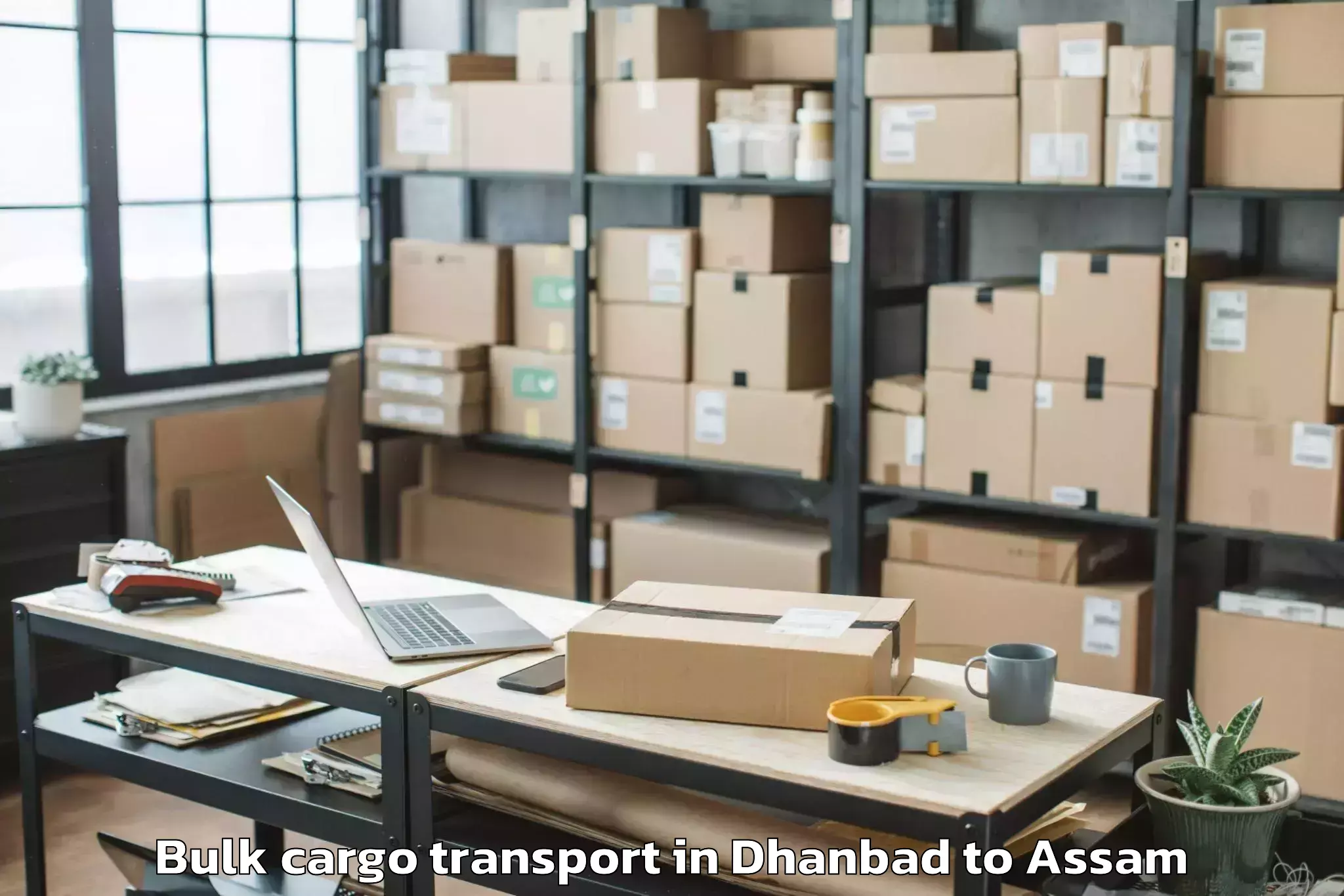 Book Dhanbad to Sualkuchi Bulk Cargo Transport